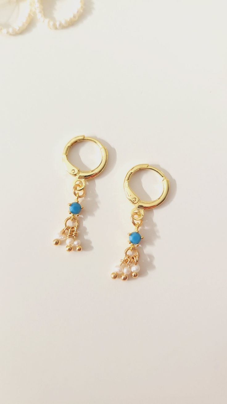 The perfect blend of elegance and simplicity with our Month Gemstone and Dainty Pearls Gold Hoops. Each pair features a delicately selected gemstone representing your birth month, complemented by lustrous, dainty pearls. Set on polished gold hoops, these earrings offer a timeless appeal, making them an ideal accessory for any occasion. Whether as a thoughtful gift or a personal treat, these gold hoops are sure to add a touch of sophistication and sparkle to any look. ✨️ Dainty Adjustable Dangle Pearl Earrings, Dainty 14k Gold Filled Birthstone Earrings, Dainty Earrings With Pearl Charm, Dainty Pearl Charm Earrings As A Gift, Dainty Pearl Charm Earrings Gift, Delicate Dangle Earrings With Birthstone, Minimalist Dangle Birthstone Earrings, Gold Plated Birthstone Dangle Earrings, Dainty Adjustable Pearl Earrings