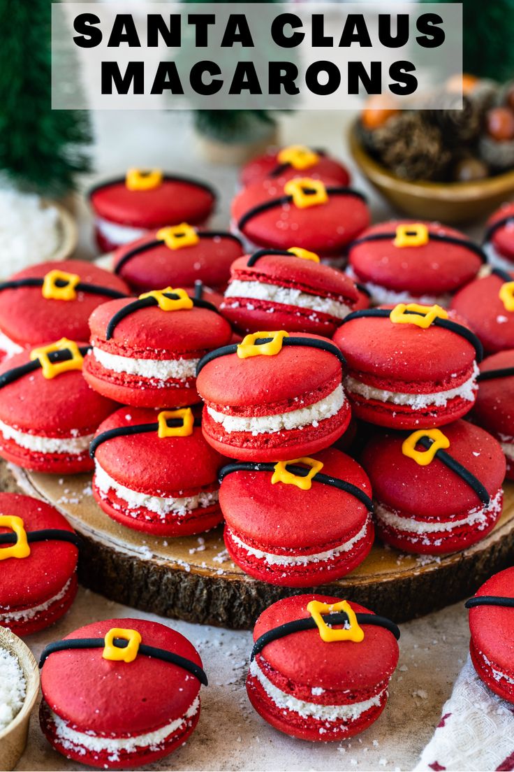 red macaroons are arranged on a wooden platter