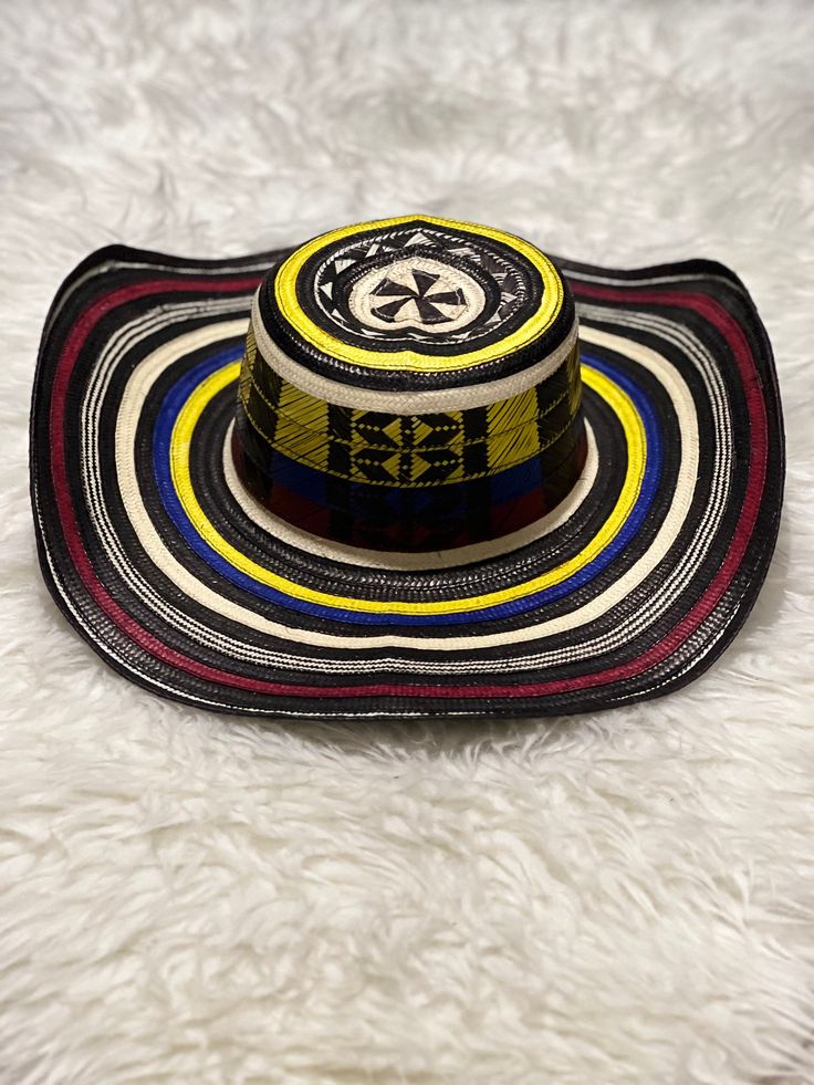 "Sombrero Vueltiao" 100% Colombian Hat 🇨🇴 Directly from the coast of Colombia Get yours today. Good for outdoor activities, the carnival or the Colombian Independence in July. You'll definitely have everyone's attention. "Sombrero Vueltiao" 100% Sombrero Colombiano 🇨🇴 Directamente desde la costa de Colombia Obtenga el suyo hoy. Bueno para actividades afuera, el carnaval o la Independencia de Colombia en Julio. Definitivamente tendrás la atención de todos. Multicolor Curved Brim Sun Hat For Rodeo, Multicolor Flat Brim Straw Hat For Rodeo, Multicolor Wide Brim Panama Hat For Festivals, Traditional Multicolor Sun Hat For The Beach, Traditional Multicolor Sun Hat For Beach, Multicolor Carnival Hats For Summer, Wide Brim Beach Hat For Cinco De Mayo, Multicolor Toquilla Straw Sun Hat For Festivals, Traditional Multicolor Wide Brim Sun Hat