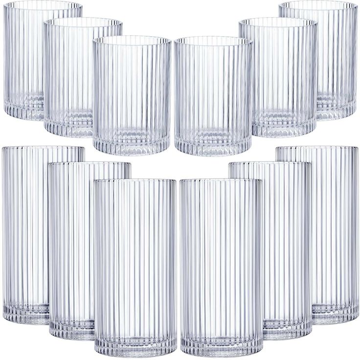 six clear glass tumblers are lined up in a row on a white background,