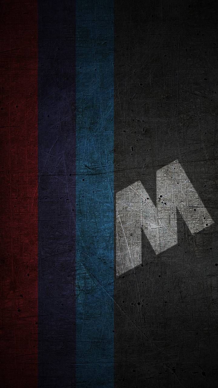 the letter n is made up of different colors and shapes on a black, red, blue, and grey background