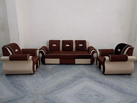 a living room filled with lots of brown and white furniture