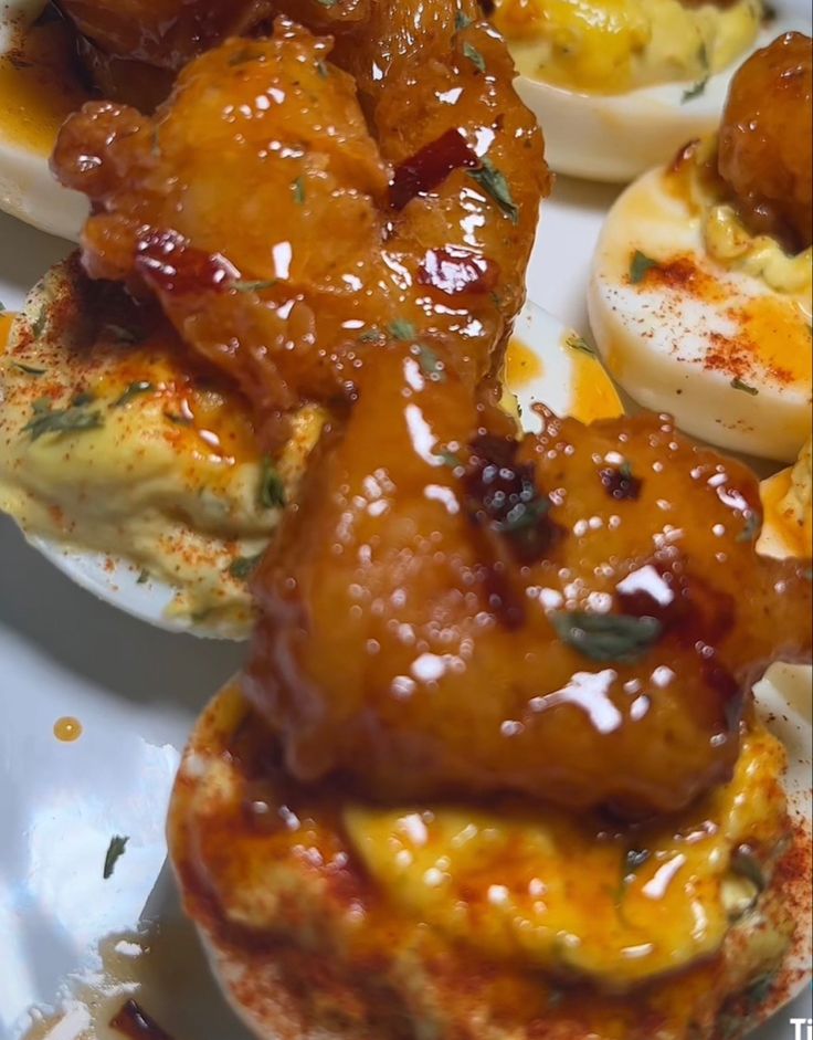 some kind of deviled eggs with sauce on them