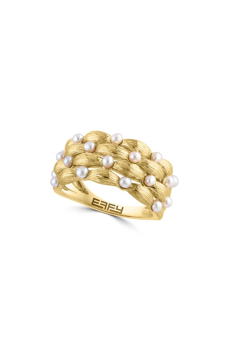 A polished 14-karat yellow-gold ring showcases pillowy, textural bands dotted with dainty freshwater pearls for elegant shine. 3/8" band width Pearl size: 2mm 14k gold/freshwater pearl Made in the USA Pearl Ring Band, Pearl Eternity Band, Pearl Wedding Band, Pearl Wedding Bands, Multi Band Ring, Keep Jewelry, Pearl Size, Pearl Ring, Eternity Bands