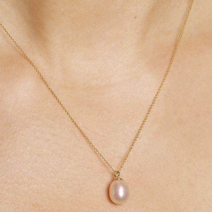 Elliptical Pearl Pendant Necklace – STONE AND STRAND Modern Pearl Charm Jewelry For Anniversary, Oval Pearl Chain Jewelry For Anniversary, Anniversary Pearl Chain Jewelry, Oval Shape, Anniversary Oval Pearl Chain Jewelry, Timeless Pearl Drop Round Pendant Jewelry, Timeless Teardrop Pearl Pendant Jewelry, Timeless Round Pendant Jewelry With Pearl Drop, Classic Oval Pearl Chain Jewelry, Delicate Oval Pendant Necklace For Formal Occasions