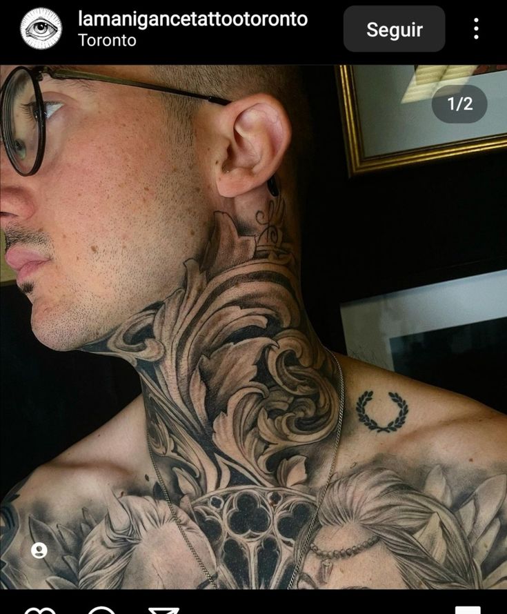 a man with tattoos on his neck and chest is looking at the camera while wearing glasses