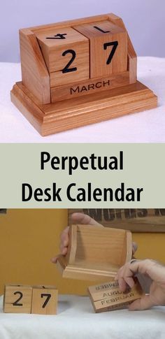 a wooden desk calendar sitting on top of a table next to a box with numbers