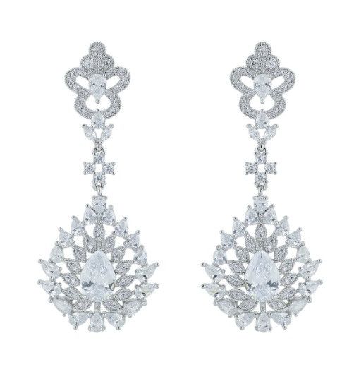 Regal Clear CZ Earrings These dazzling pierced earrings will add a regal touch to your wedding day. The unique vintage inspired design is plated in silver platinum and is adorned with 5A quality and clear cz crystals for amazing sparkle. The post is plated in925 Silver. Size: about 2 1/2" long and 1" wide at the widest point. Color: Silver/Clear. Style: E1007-C. Also available in Sapphire Blue as E1007 . Please allow 2-3 weeks for delivery. Shipping Policy . Return Policy White Gold Cubic Zirconia Chandelier Earrings For Wedding, Glamorous Formal Clip-on Bridal Earrings, Glamorous White Gold Bridal Earrings For Formal Occasions, Silver Diamond Earrings With Intricate Design For Wedding, Silver Diamond Clip-on Earrings For Wedding, Silver Crystal Chandelier Earrings For Anniversary, White Pierced Diamond Wedding Earrings, Silver Diamond Bridal Earrings With Elegant Design, White Pierced Diamond Earrings For Wedding