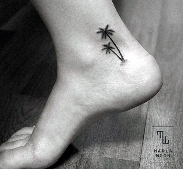 a small palm tree tattoo on the left side of the foot is shown in black and white