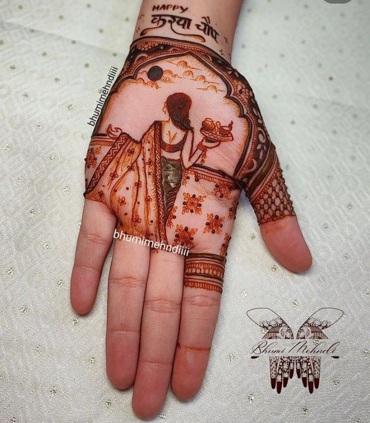 a woman's hand decorated with hennap and designs for her wedding day