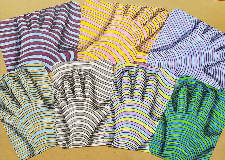 six different colored papers with wavy lines on them