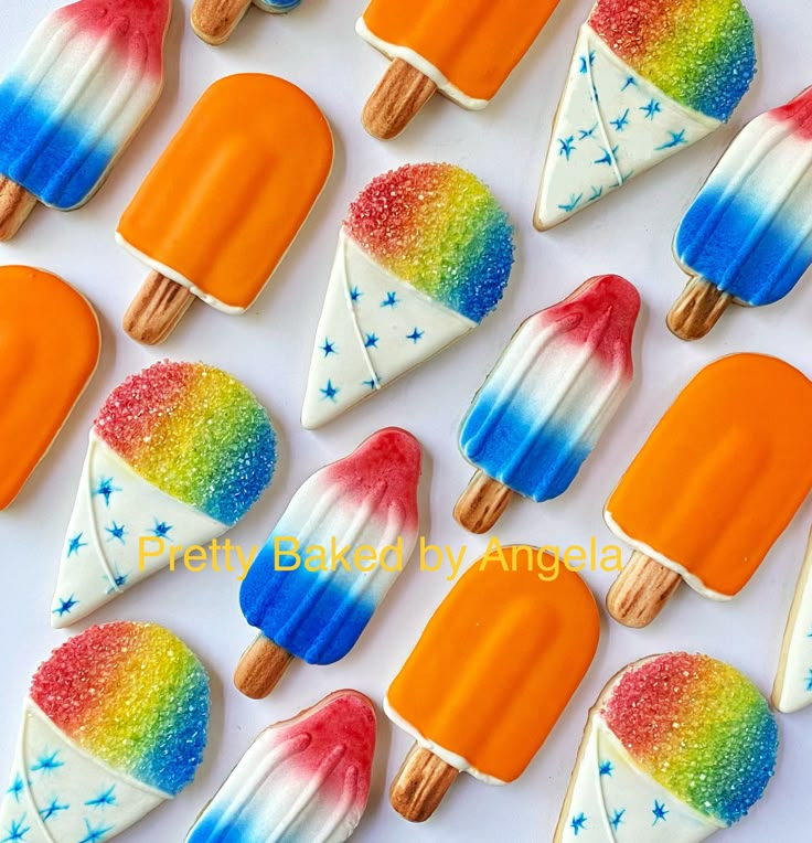 colorful popsicles are arranged in rows on a white surface with blue, orange, and yellow stars