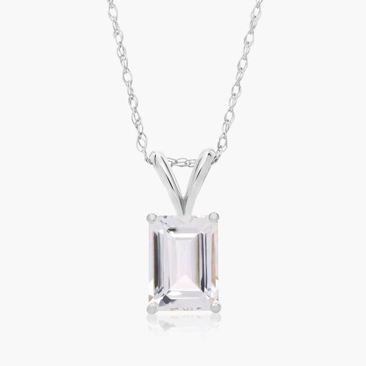 14K White Gold Emerald Cut White Topaz Birthstone Pendant Necklace. Add eleganace to every outfit with this gorgeous emerald cut birthstone pendant necklace. Whether for everyday or a special event, this necklace brings the perfect amount of luxury and color. Pair it with the matching earrings for seamless shine. White Sterling Silver Necklace Emerald Cut, Elegant White Emerald Cut Necklace, Emerald Cut Diamond White Sterling Silver Necklace, Elegant White Emerald-cut Necklace, White Emerald-cut Sterling Silver Necklace, Topaz Birthstone, Birthstone Pendant, Fine Jewellery Necklace, White Topaz