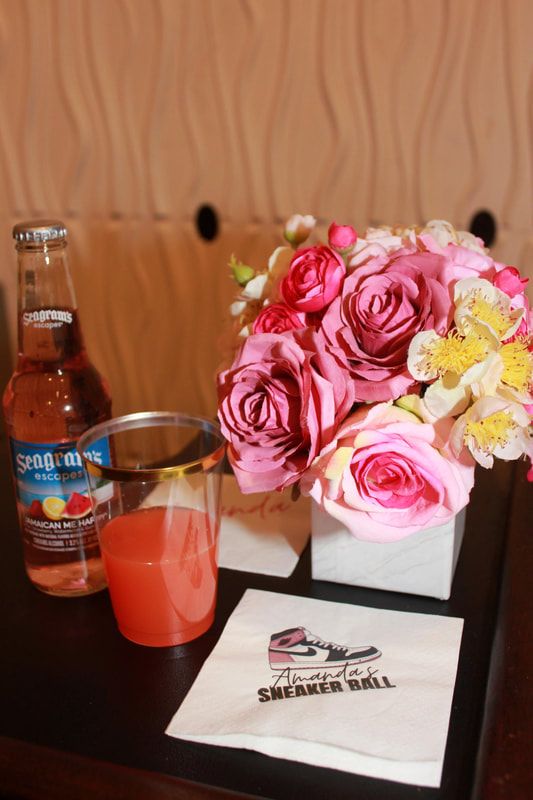 a table with flowers and drinks on it