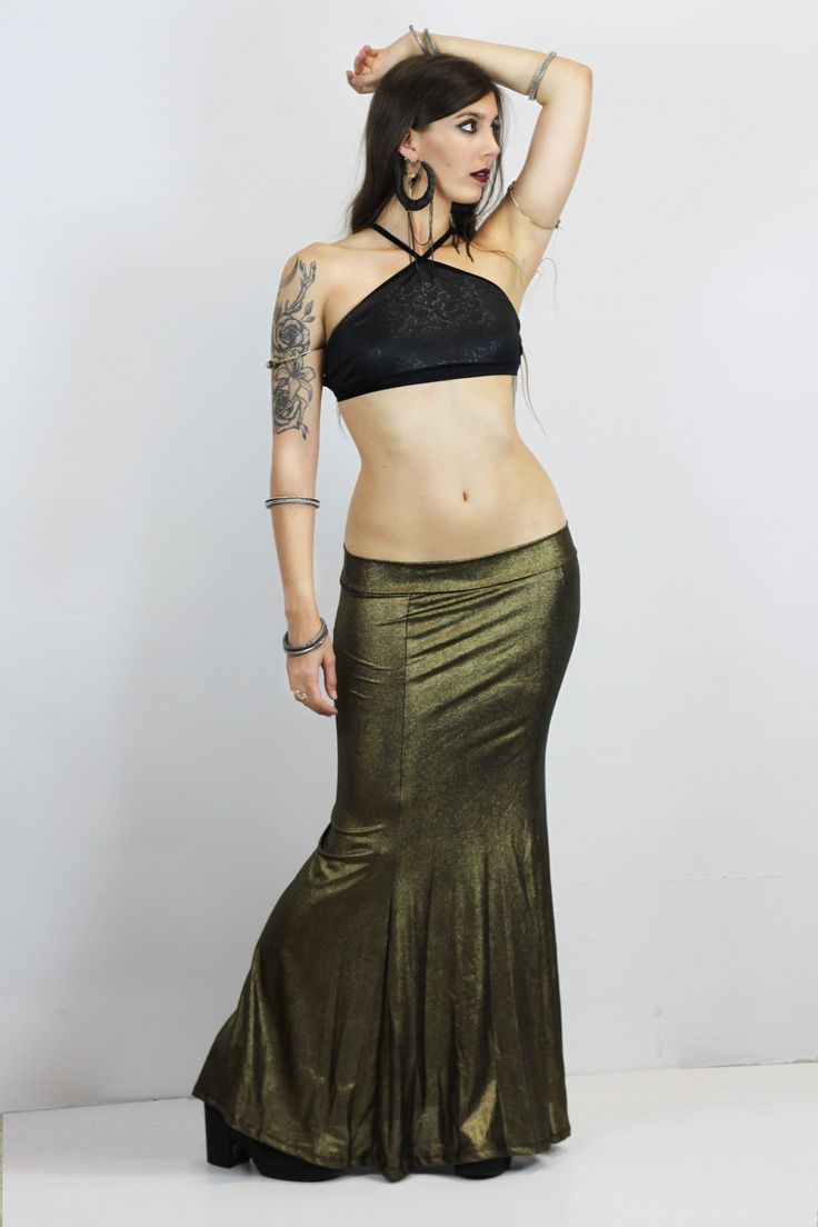 GOLD VINTAGE MERMAID SKIRT This gorgerous metallic mermaid skirt is available in old gold and dark silver colors, perfect to level up any look with this metallic efect. The beautiful mermaid shape makes every body type look gorgerous and stylized. Perfect for several looks, night outfits, stage and performances, or a more casual extravagant look, your choice! Super elastic and incredibly confortable, it adapts perfectly to all your movements. Long strech mermaid skirt. They can be machine washed Fitted Gold Flared Skirt, Gold Fitted Flared Skirt, Party Maxi Skirt With Stretch In Fishtail Style, Party Fishtail Maxi Skirt With Stretch, Fishtail Stretch Maxi Skirt For Party, Stretch Fishtail Maxi Skirt For Party, Gold Stretch Skirt For Party, Metallic Flared Skirt, Gold Long Skirt For Night Out