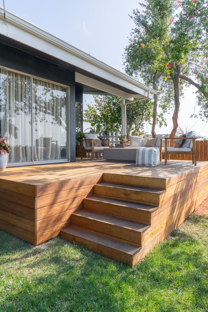 a wooden deck with steps leading up to it