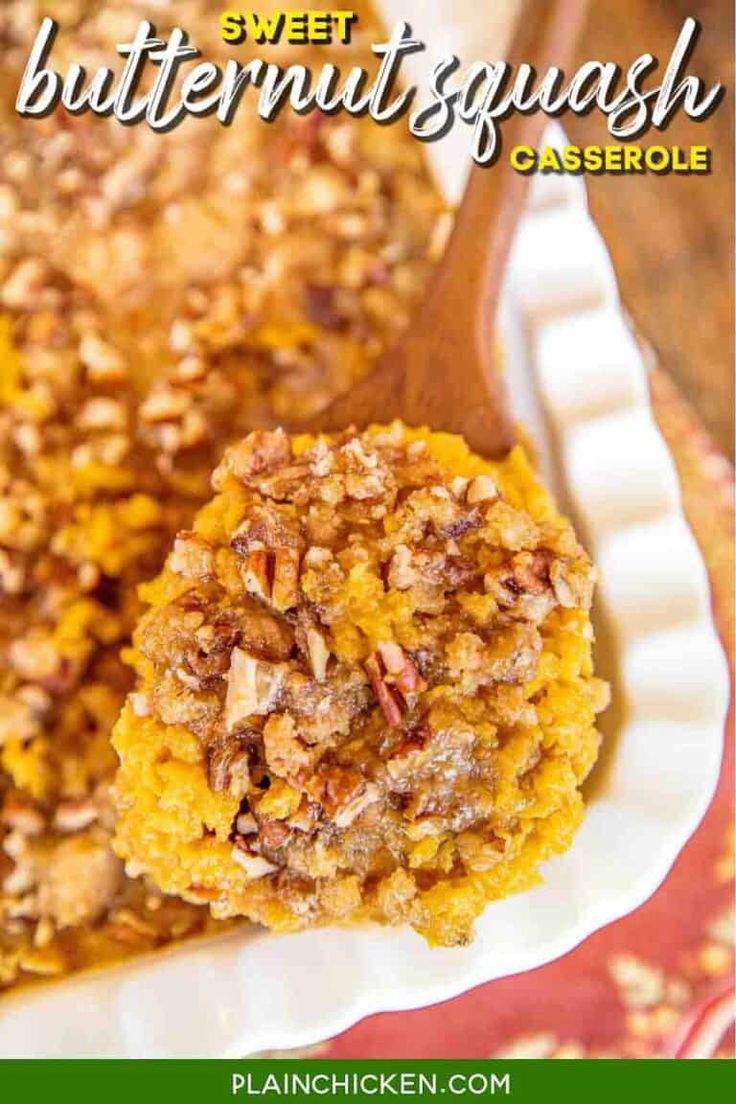 sweet butternut squash casserole on a white plate with a wooden spoon