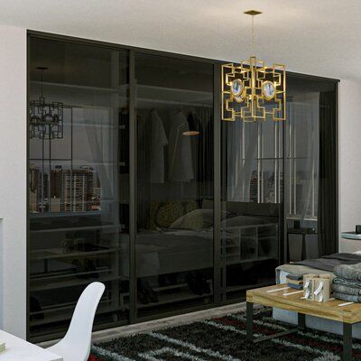 a living room filled with furniture and a chandelier hanging over it's windows