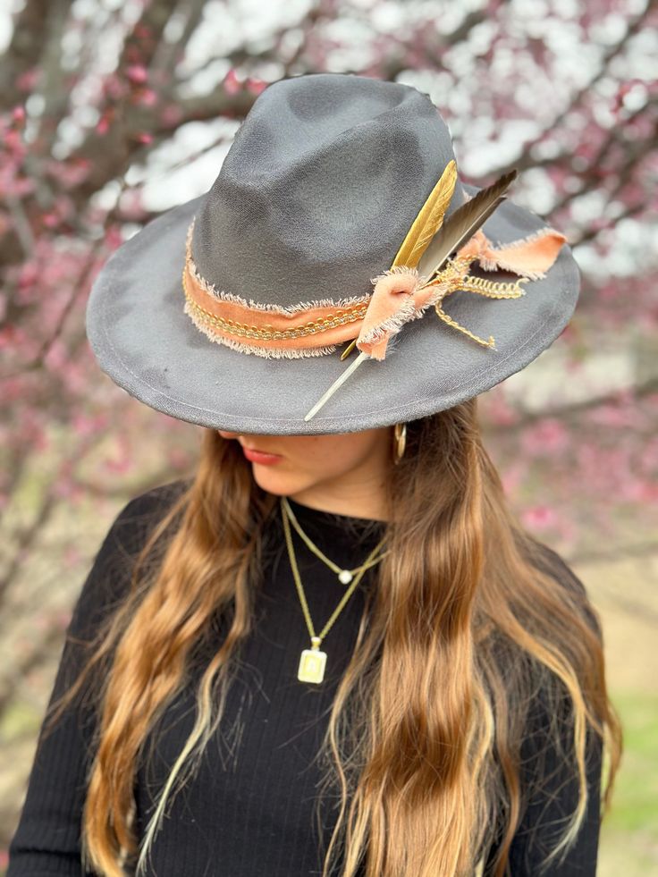 Gray wide brim fedora decorated with pink and gold hat bands, and two feather accents. Gold Hat, Hat Bands, Gold Hats, Wide Brim Fedora, Hat Band, Wide Brimmed, Fedora, Pink And Gold, Caps Hats