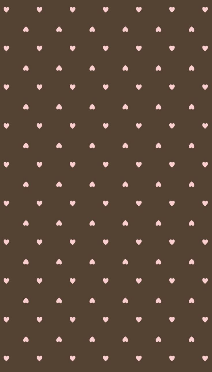 a brown background with small pink hearts on the top and bottom, all in different sizes