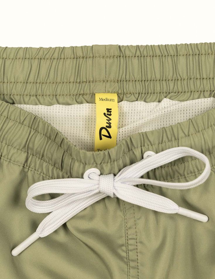 Our elastic Swim Shorts are your new go-to for leisurely days in the sun. These vintage trunks are made of 100% poly in a comfort short / wide fit. Every pair is equipped with a tearaway size tag for max waist comfort. Meet your new favorite beach trunk. Pair it with your favorite Duvin tee and hat. 100% Polyester Wide-leg relaxed fit Tearaway size tag 14.6'' size Medium outseam (scales up and down depending on size - we recommend sizing up if you want a little length 5'' inseam Premium soft box Swim Shorts Women, Vintage Trunks, Swim Short, Suits For Sale, Beach Kids, Beach Pants, One Piece Suit, Sports Top, Beach Club