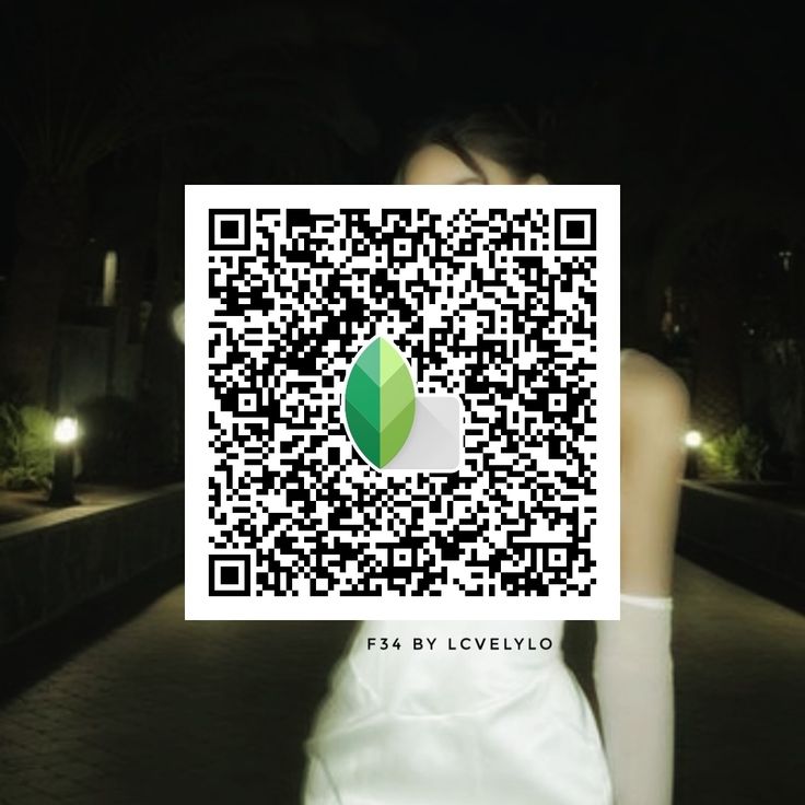 a woman in white dress holding up a qr - code to show her profile