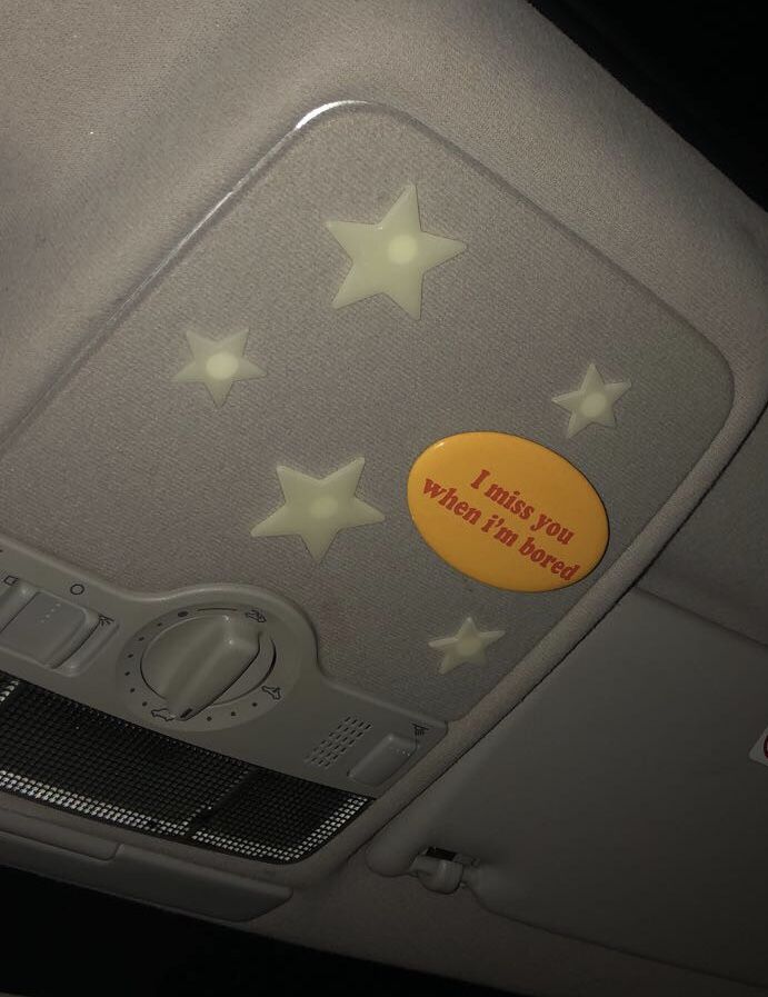 the inside of a car with stars on it and a sign that says, trust us when i'm bored