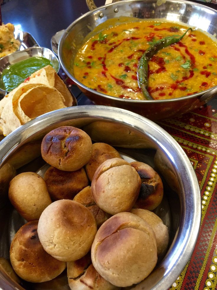 several bowls filled with different types of food