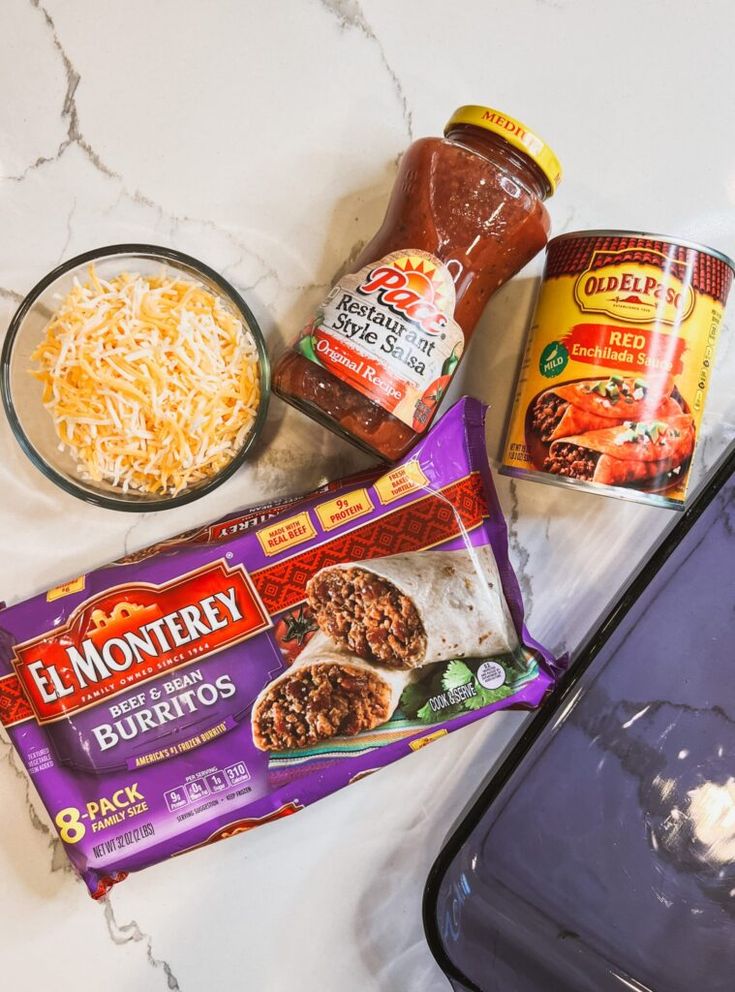 ingredients to make an enchilada casserole laid out on a counter