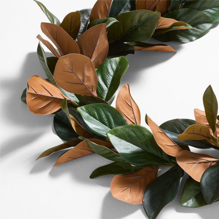 a close up of a wreath made out of leaves