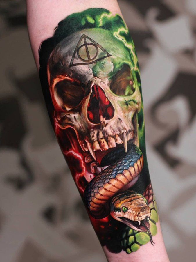 a man with a tattoo on his arm has a skull and snake in the background