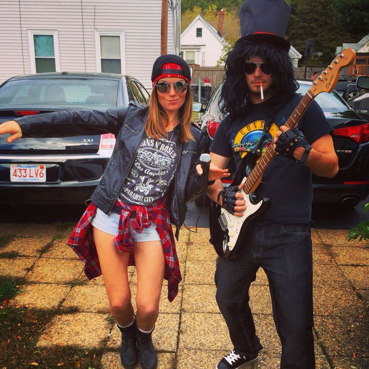 a man and woman dressed up as rock band members