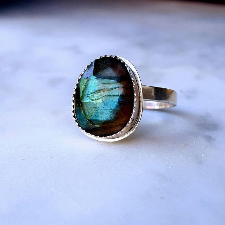 Labradorite Ring Labradorite Labradorite Jewelry Labradorite Ring Silver Gemstone Ring Statement Ring Labradorite Rings Blue Labradorite Unique statement ring featuring a blue green flash,labradorite gemstone.Elegant, delicate and versatile. Materials: ✔Sterling silver band ✔High quality labradorite gemstone. ✔Gemstone size appr.6-8mm Ideal gift for that special lady, bridesmaids, best friend, mom, sister, daughter, aunt and teacher! 📌 Important note regarding Labradorite - the colors cannot be Labradorite Gemstone Oval Ring, Oval Labradorite Gemstone Ring, Oval Labradorite Ring With Natural Stones, Handmade Healing Ring With Oval Cabochon, Unique Healing Rings With Natural Inclusions, Handmade Labradorite Oval Cabochon Ring, Adjustable Labradorite Cabochon Ring, Adjustable Cabochon Labradorite Ring, Spiritual Labradorite Round Ring