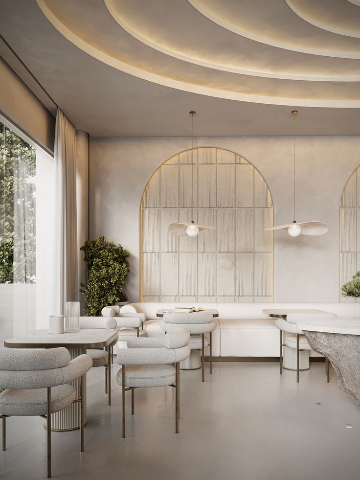 the interior of a modern restaurant with white furniture and round arches on the ceiling, along with potted plants