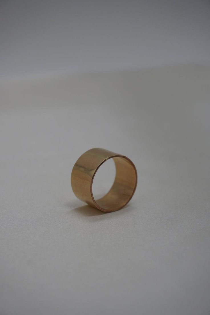 This simple yet bold ring is stunning on its own or layered. The cigar style is classic and timeless. Materials: 14k Gold Fill, Sterling Silver Measurements: This band measures 12 mm wide Timeless 14k Gold Wide Band Ring With Open Band, Timeless 14k Gold Wide Band Ring With Open Design, Timeless Wide Band 14k Gold Open Ring, Timeless Wide Band Open Ring In 14k Gold, Timeless Yellow Gold Wide Band Ring, Timeless Wide Band Ring 14k Gold, Classic Formal Wide Band Ring With Open Band, 14k Gold Wide Band Promise Ring, Minimalist Wide Band With Polished Finish