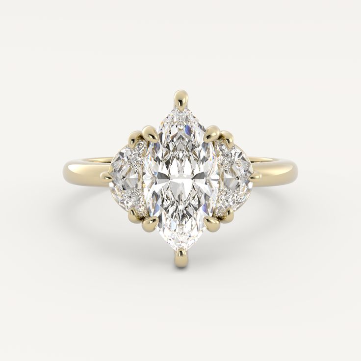 an oval cut diamond ring with three pear shaped diamonds