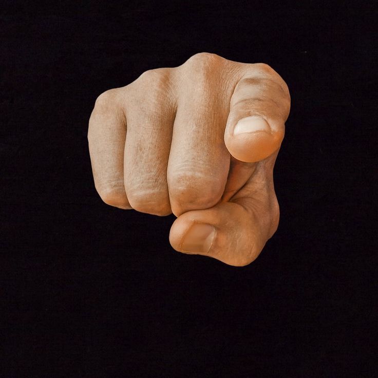 a close up of a fist on a black background