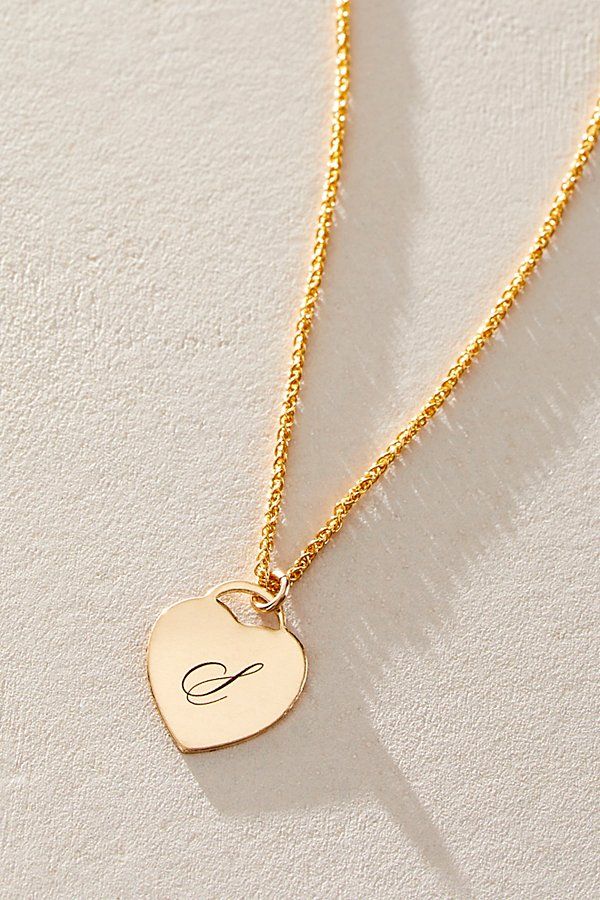 Just as effortless as it is elegant, this stunning necklace features a heart-shaped pendant with gorgeous cursive engraved initial for the ideal finishing touch. * 14k Gold Filled wheat chain * Personalized, laser engraved, 14k Gold Filled 12x14mm heart charm * Length: 18" * 5 days of production | Set & Stones Personalized Alice Necklace at Free People in Gold Elegant Engraved Nameplate Initial Necklace, Elegant Engraved Initial Necklace For Anniversary, Elegant Initial Pendant Necklace For Anniversary, Elegant Silver Heart Pendant Initial Necklace, Elegant Pendant Initial Necklace For Anniversary, Elegant Silver Heart Initial Necklace, Elegant 14k Gold Name Necklace With Heart Pendant, Elegant 14k Gold Heart Pendant Name Necklace, Elegant Engraved Heart Necklace For Mother's Day