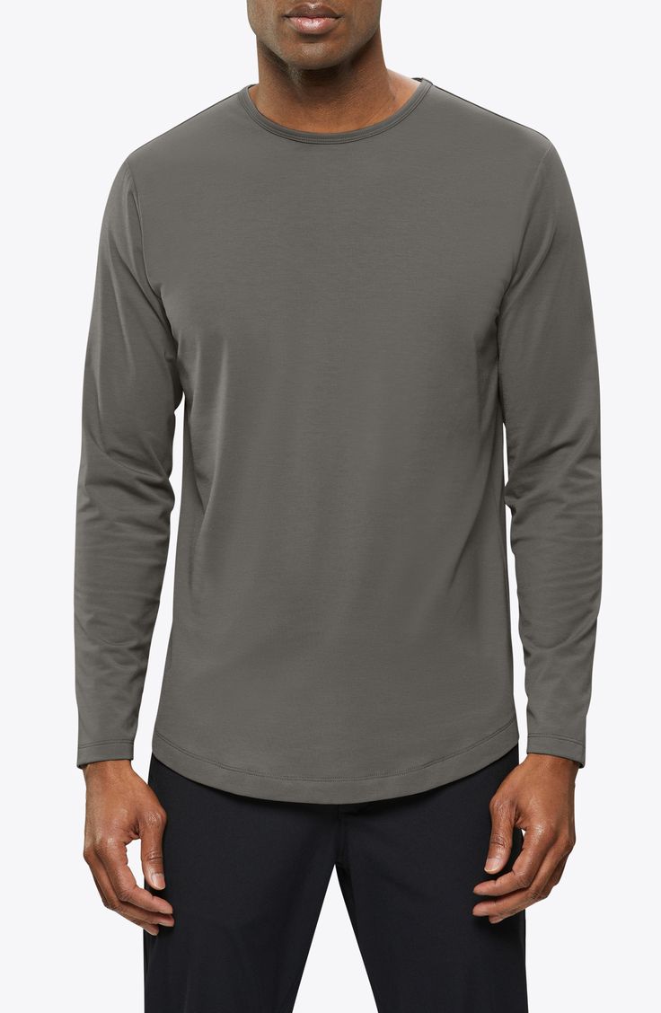 Made from a soft cotton blend, a versatile long-sleeve T-shirt enhanced with a curved hem is an instant closet favorite that looks great alone or layered. 28 1/2" length (size Medium) Crewneck Long sleeves 62% polyester, 33% cotton, 5% spandex Machine wash, tumble dry Imported Everyday Crew Neck Long Sleeve Top With Thumbholes, Crew Neck Long Sleeve Cotton Top With Thumbholes, Cotton Long Sleeve Crew Neck Top With Thumbholes, Cotton Long Sleeve Top With Thumbholes And Crew Neck, Casual Gray Tops With Thumbholes, Stretch Long Sleeve T-shirt For Layering, Basic Long Sleeve T-shirt For Layering, Versatile Long Sleeve T-shirt, Gray Crew Neck Tops With Thumbholes