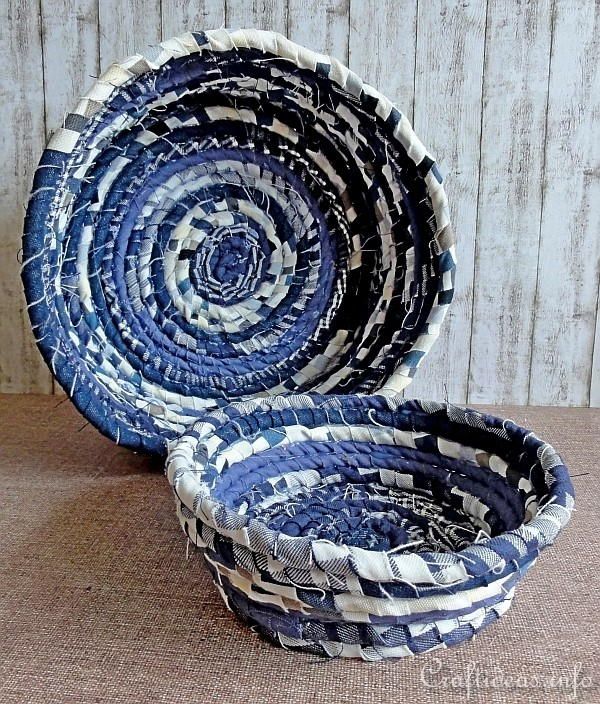 two blue and white baskets sitting next to each other