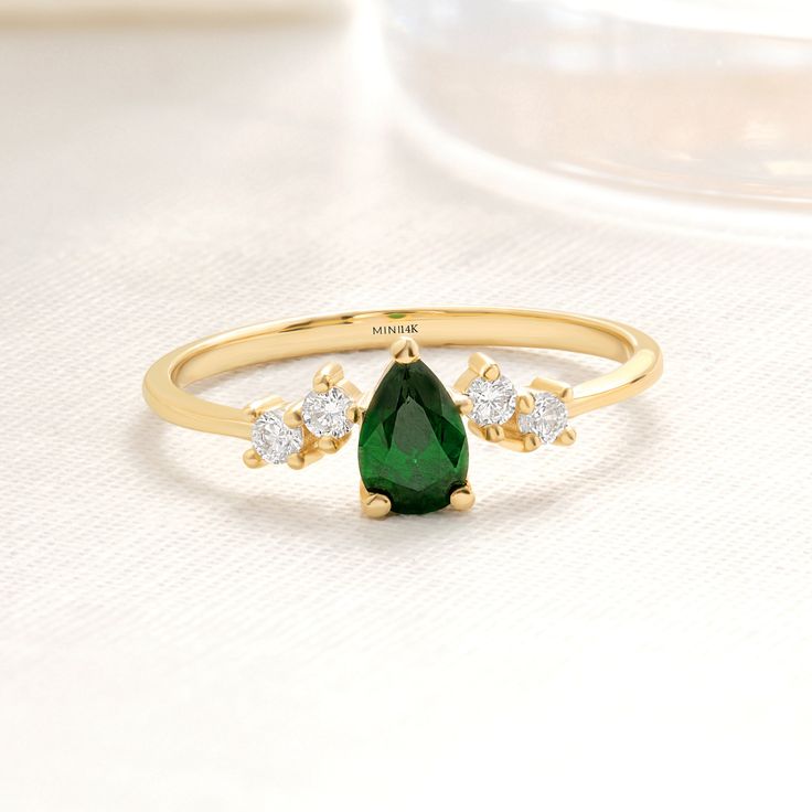 Pear & tear drop cut emerald green color birthstone & birth month gemstone ring with 14K solid gold jewelry is handmade per your order. (for real & genuine & raw or natural emerald ring please contact us) Customers love to buy personalized & custom wedding, engagement, promise and she said yes ring items like our cute jewelry for special occasions (expecting, wedding, bachelorette party, promoted to, remembrance, bridal shower, thank you or special day (thanksgiving, mother's day, christmas, fathers day, xmas, valentine's day, anniversary, summer, winter, halloween, just because, thanksgiving, black friday,  birthday, easter day, married) Jewelry Details Gemstone: AAA Cubic Zirconia Side Stones: AAA Cubic Zirconia Band:14K Solid Gold Carat:585 Our products are AAA+ quality cubic zirconia. Teardrop Emerald Green Rings, Teardrop Green Emerald Rings, Green Emerald Teardrop Rings, Green Teardrop Emerald Rings, Green Teardrop Ring For May Birthstone, Green Teardrop Emerald Ring For May Birthstone, Teardrop Green May Birthstone Ring, Green Teardrop May Birthstone Ring, Green Pear-shaped Emerald Ring For Anniversary