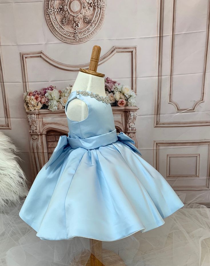 Fabulous Baby Girl formal blue dress. This is one of a kind princess dress.This gorgeous Cinderella-like dress is one of a kind. Beautifully crafted with decorating crystal around neckline and bows (front and back bows are detachable). Fully lined. Impressive attention to detail. Perfect gift for your little princess!! Features:Made of soft, comfortable and high quality material, Satin and Tulle. This party dress features three layers for an extra puffy look and it is yet very conformable. Dress Elegant Blue Princess Dress For Baptism, Elegant Blue Princess Dress With Bow, Blue Wedding Dress With Satin Bow, Light Blue Princess Dress For Baptism, Princess Style Pageant Dress With Satin Bow, Blue Princess Dress With Bow For Dress-up, Blue Princess Dress With Bow, Light Blue Princess Style Pageant Dress, Princess Style Light Blue Pageant Dress