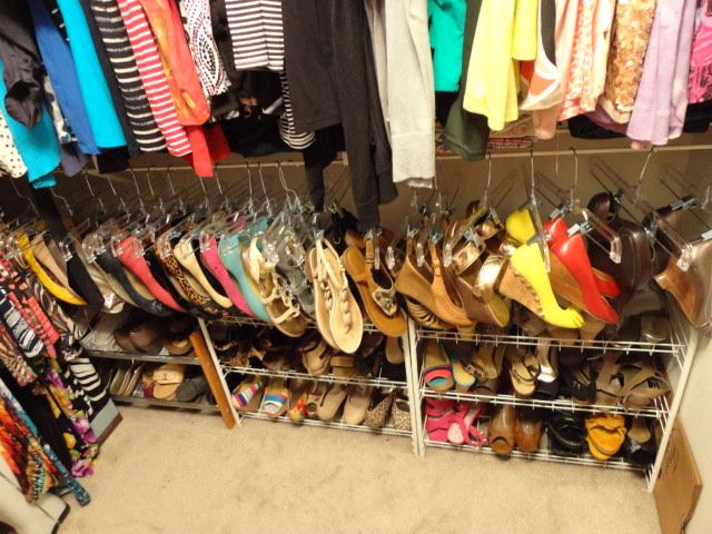 a closet filled with lots of different types of shoes