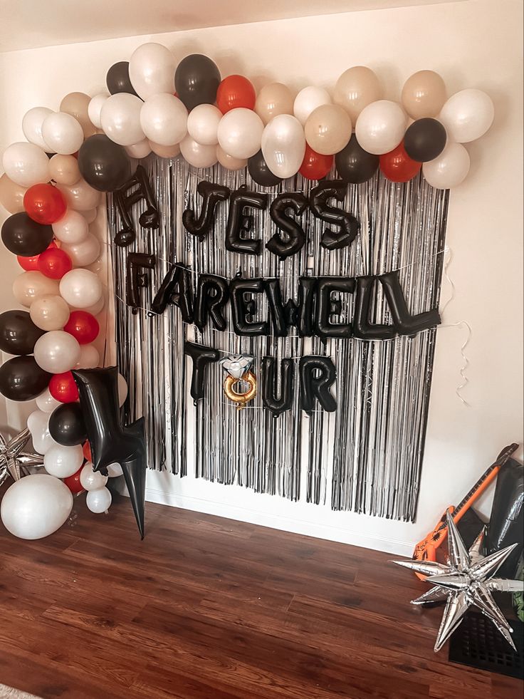 balloons and streamers decorate the entrance to a party