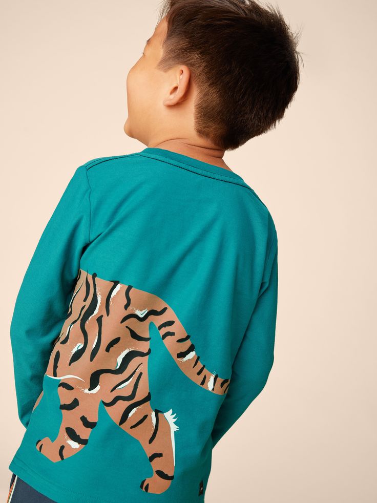 Kids go crazy for our two-sided tops! Perfect for the kiddo always on the prowl for his next big adventure, this long sleeve tee is made from our signature soft and durable 100% cotton. So durable, features an interior neck tape for lasting quality, and is crafted so its color and shape last, season after season. Pair with joggers or Playwear Pants to complete the look. Above thigh length. Playful Long Sleeve T-shirt With Graphic Print, Long Sleeve Cotton T-shirt For Playwear, Fun Long Sleeve T-shirt With Screen Print, Graphic Print Tops For Playwear In Fall, Long Sleeve Cartoon Print Tops For Playwear, Cotton Top With Dinosaur Print For Fall, Cotton Tops With Dinosaur Print For Fall, Cotton Long Sleeve Tops With Dinosaur Print, Long Sleeve Cotton Tops With Dinosaur Print