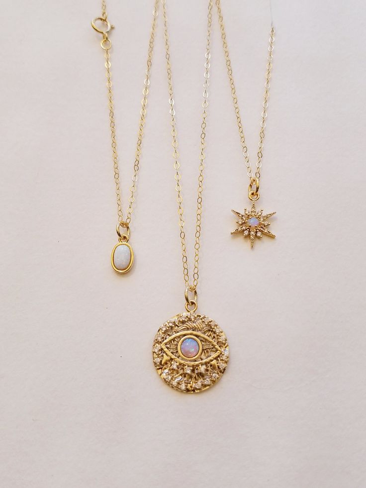 "Opal Necklace, Gifts for Her, Dainty necklace, Opal Jewelry, Necklaces for Her, Minimalist, Opal, Minimalist Jewelry, Dainty Jewelry A perfect dainty necklace for her! ★ Details: ~Opal Pendant Options: Drop, NorthStar, Evil Eye, Oval, Round ~The chain is made up of 14 K gold filled material with spring clasp. ~ Available in various lengths. ~Comes elegantly in a cute package, ready to give. ★How to Order: ~Please select your desired length and pendant under \" SELECT AN OPTION\". ★Enter Azram D White Celestial Clavicle Chain Jewelry, Celestial White Clavicle Chain Jewelry, Celestial Style White Clavicle Chain Jewelry, White Celestial Choker Jewelry, White Celestial Necklace With Adjustable Chain, Celestial White Necklace With Adjustable Chain, Celestial Necklace With Delicate Chain As A Gift, White Celestial Charm Necklace As Gift, White Celestial Charm Necklace For Gift