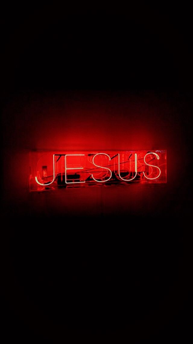 a red neon sign that says jesus on it