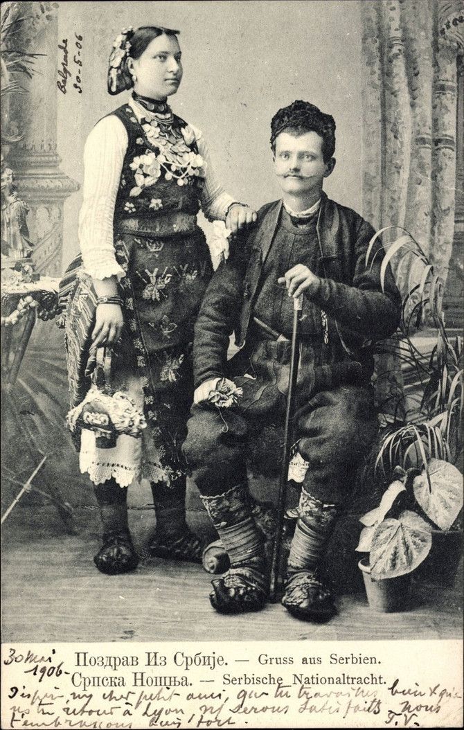 an old black and white photo of two people