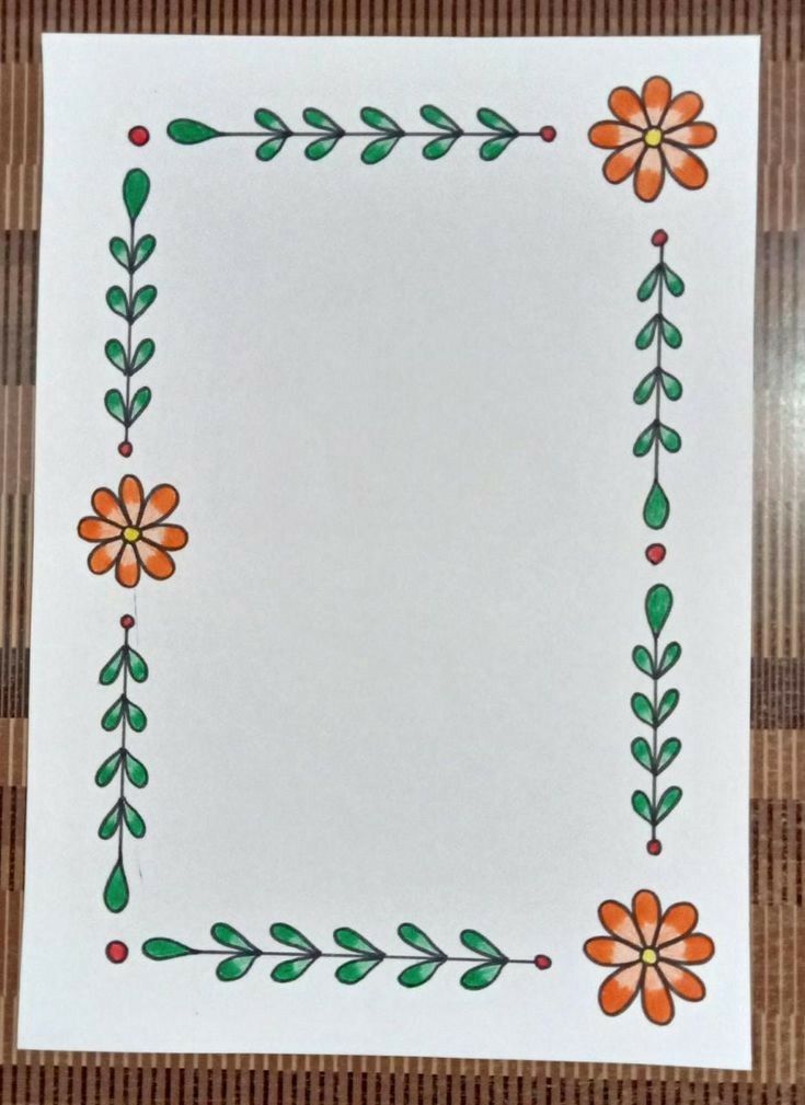 a white paper with orange and green flowers on it