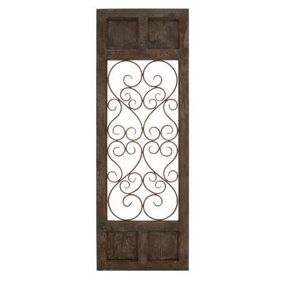 an old wooden door with wrought iron design